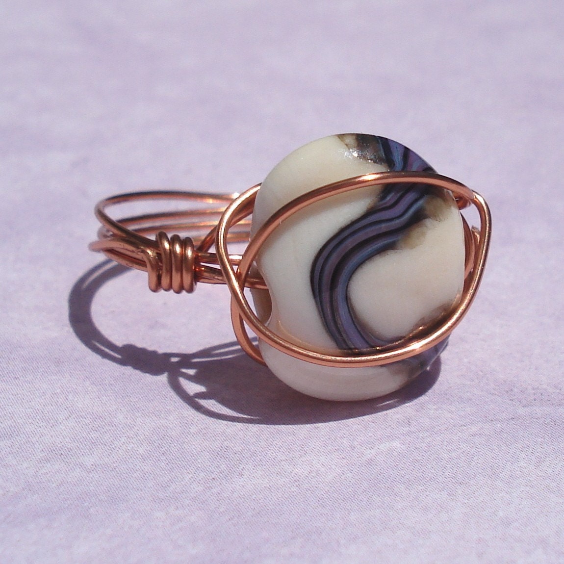 wire wrapped copper ring with artisan lampwork glass bead