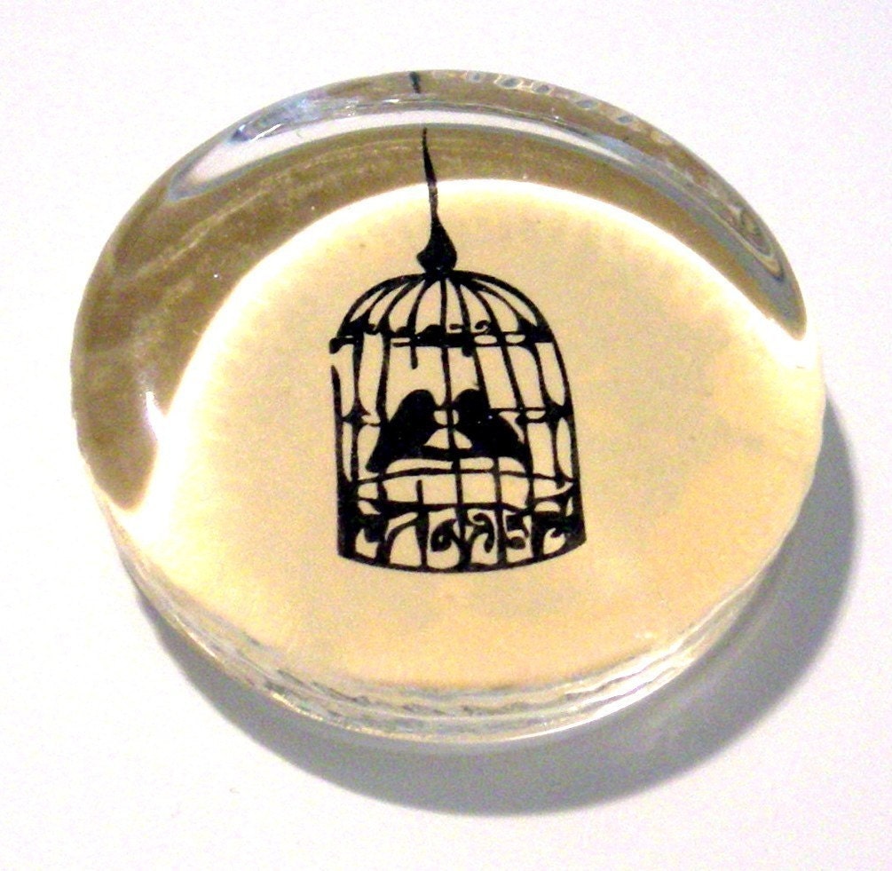 Birds in a cage paperweight