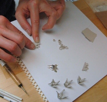 silver origami peace crane tsuru pendants in progress