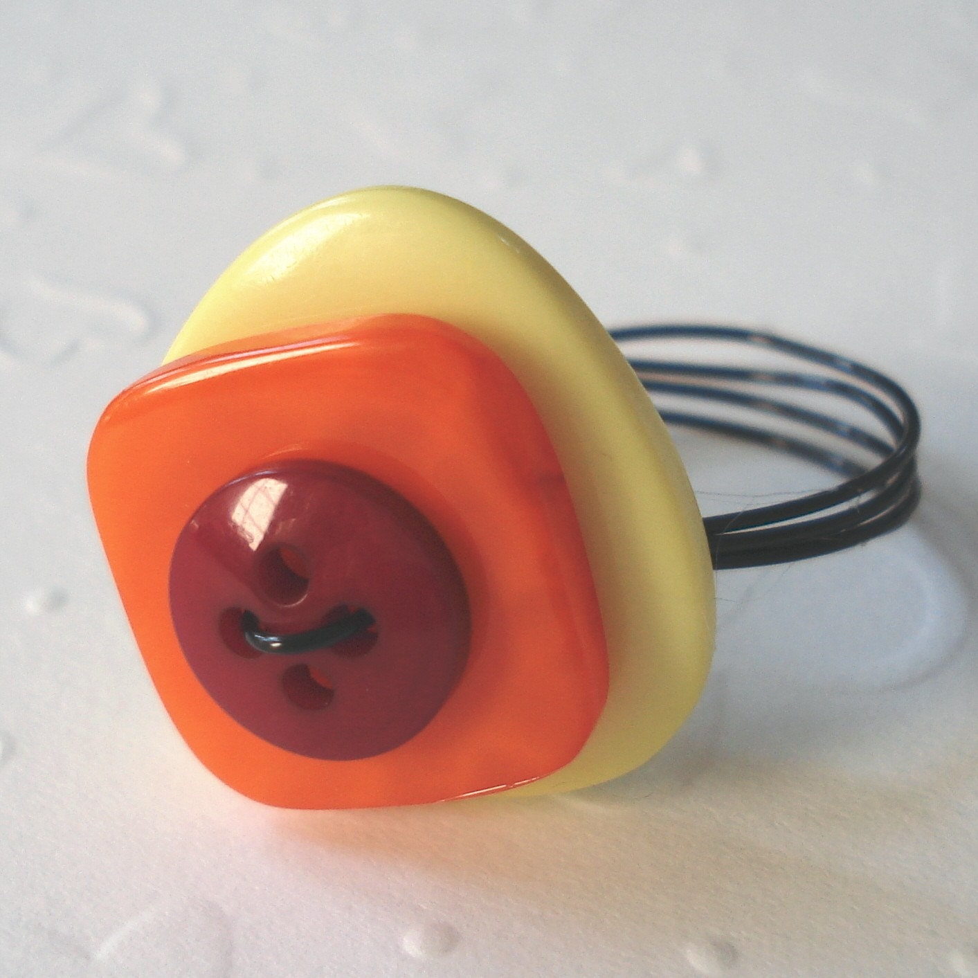 Ring of fire button ring