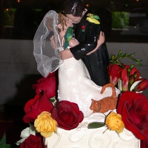  the personalized bride and grooms kissing cake toppers on wedding cakes.